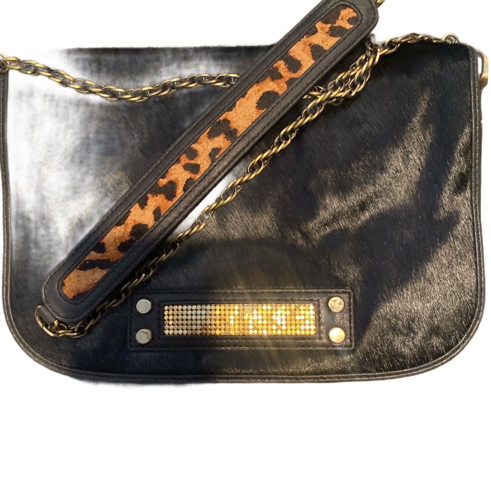 CLIO GOLDBRENNER--leather leopard print Crossbody with gold metal accents.